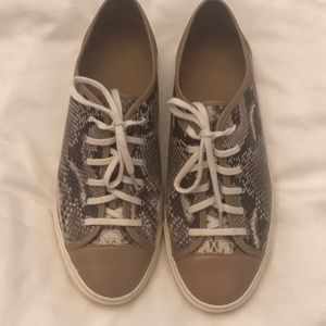 Cole Haan snakeprint sneakers.